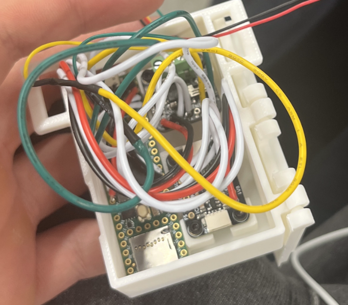 Open electronics package showing wiring and embedded boards