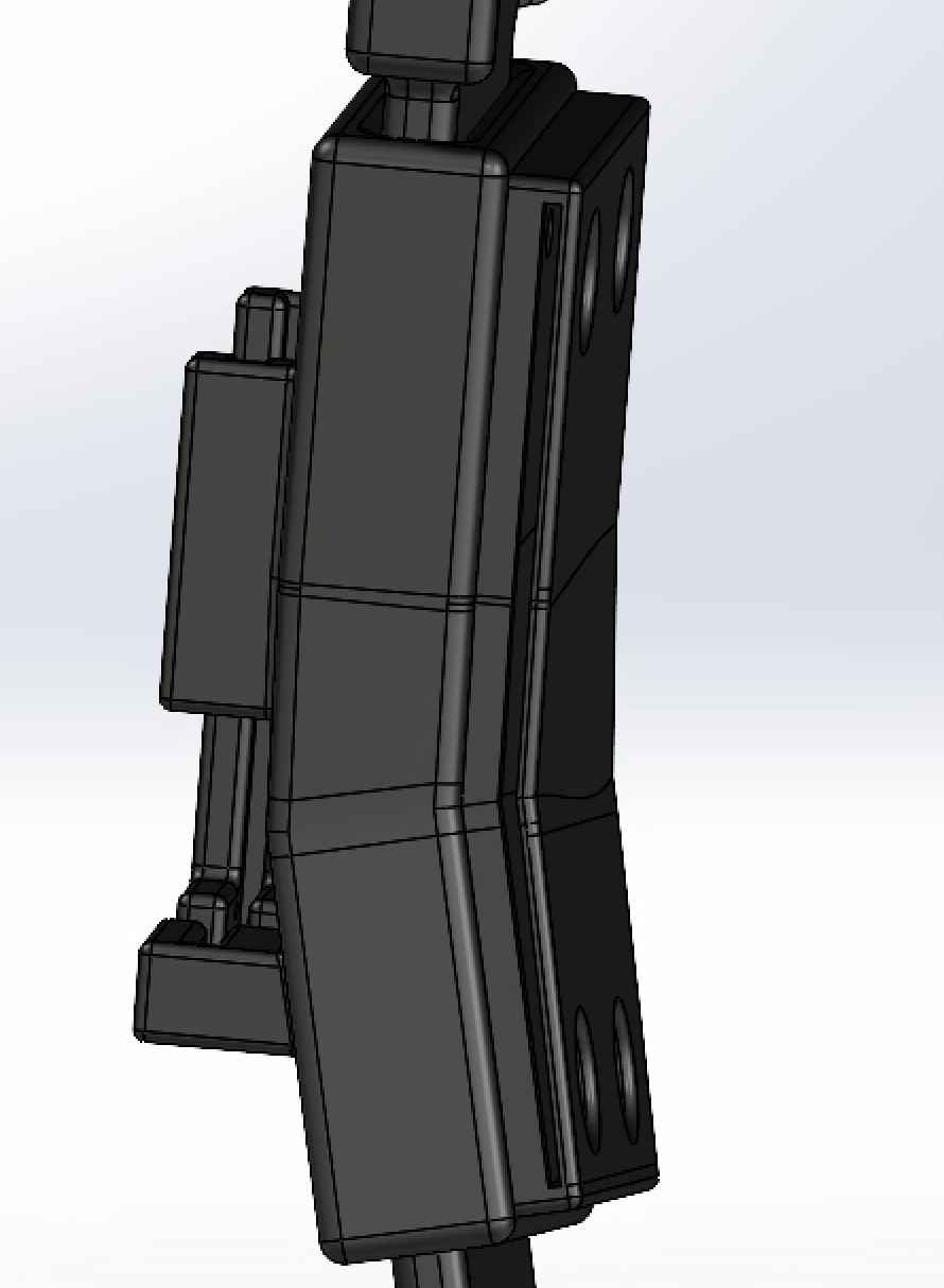 CAD close-up of the strap anchor integrated into the shin exoskeleton structure